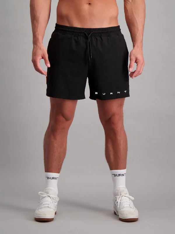 Men's ripped denim shorts for a trendy streetwear aesthetic Bondi 5" Short - Core Black Men's ripped denim shorts for a trendy streetwear aesthetic Bondi 5" Short - Core Black